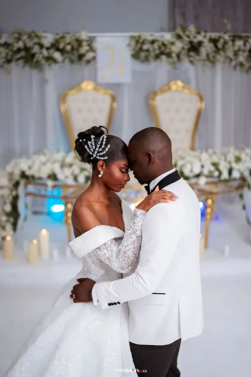 The couple embracing in church. CameraBoss portfolio: Jide and Vivian.
