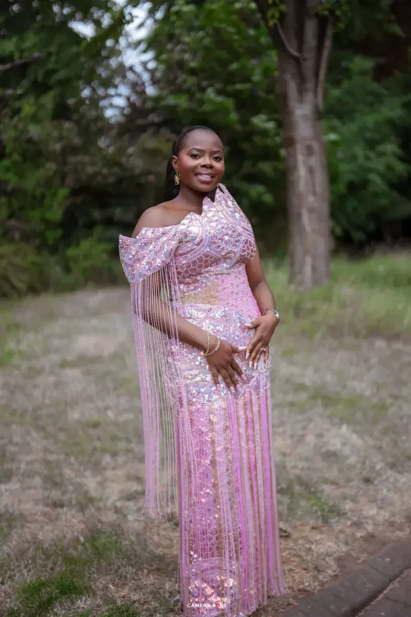 An outdoor portrait in pink clothes. CameraBoss portfolio: Temi and Fiyin.