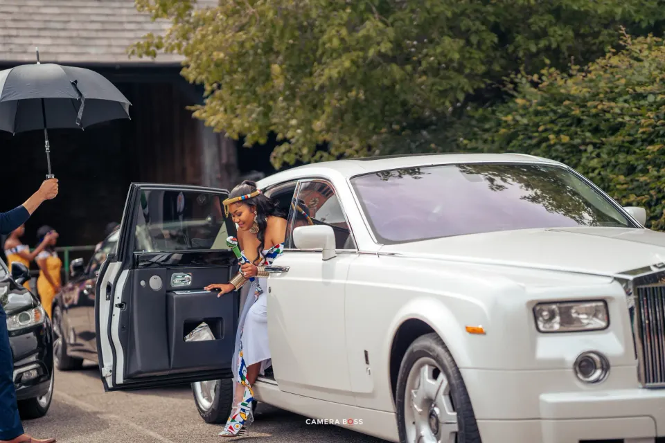 Vanessa arriving in a white car. CameraBoss portfolio: Vanessa Wedding.
