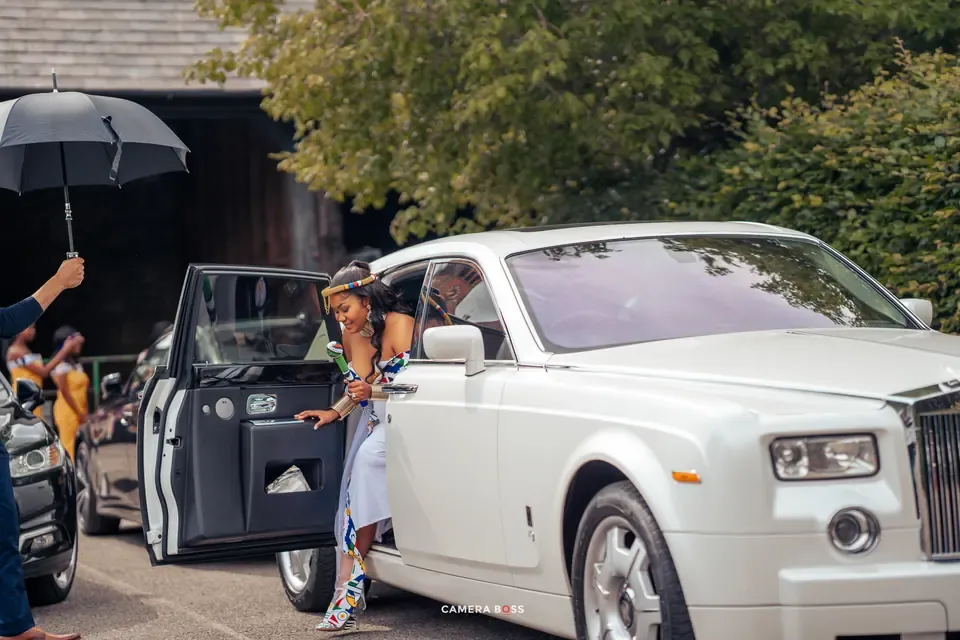 Vanessa arriving in a white car