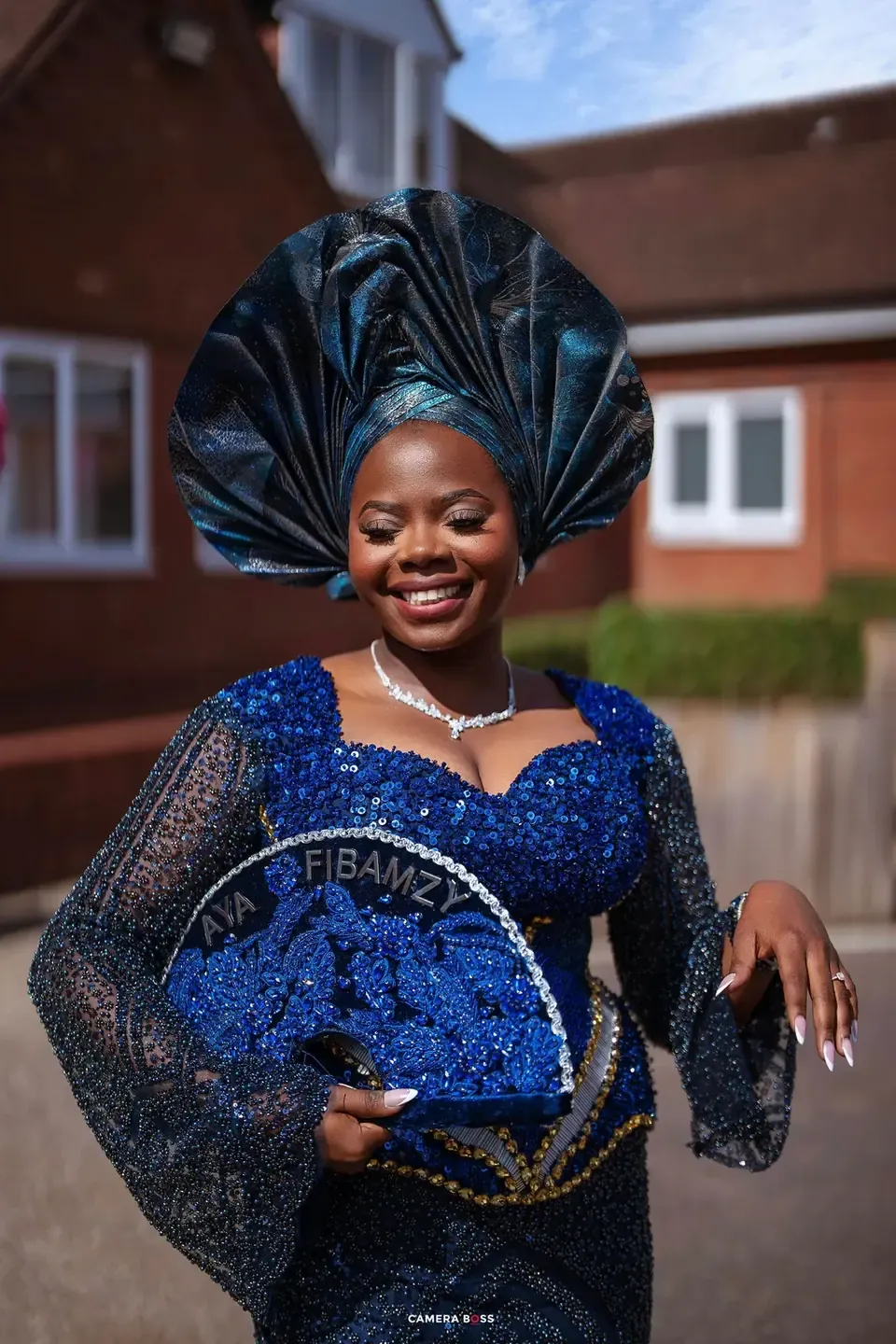 Temi in blue traditional attire