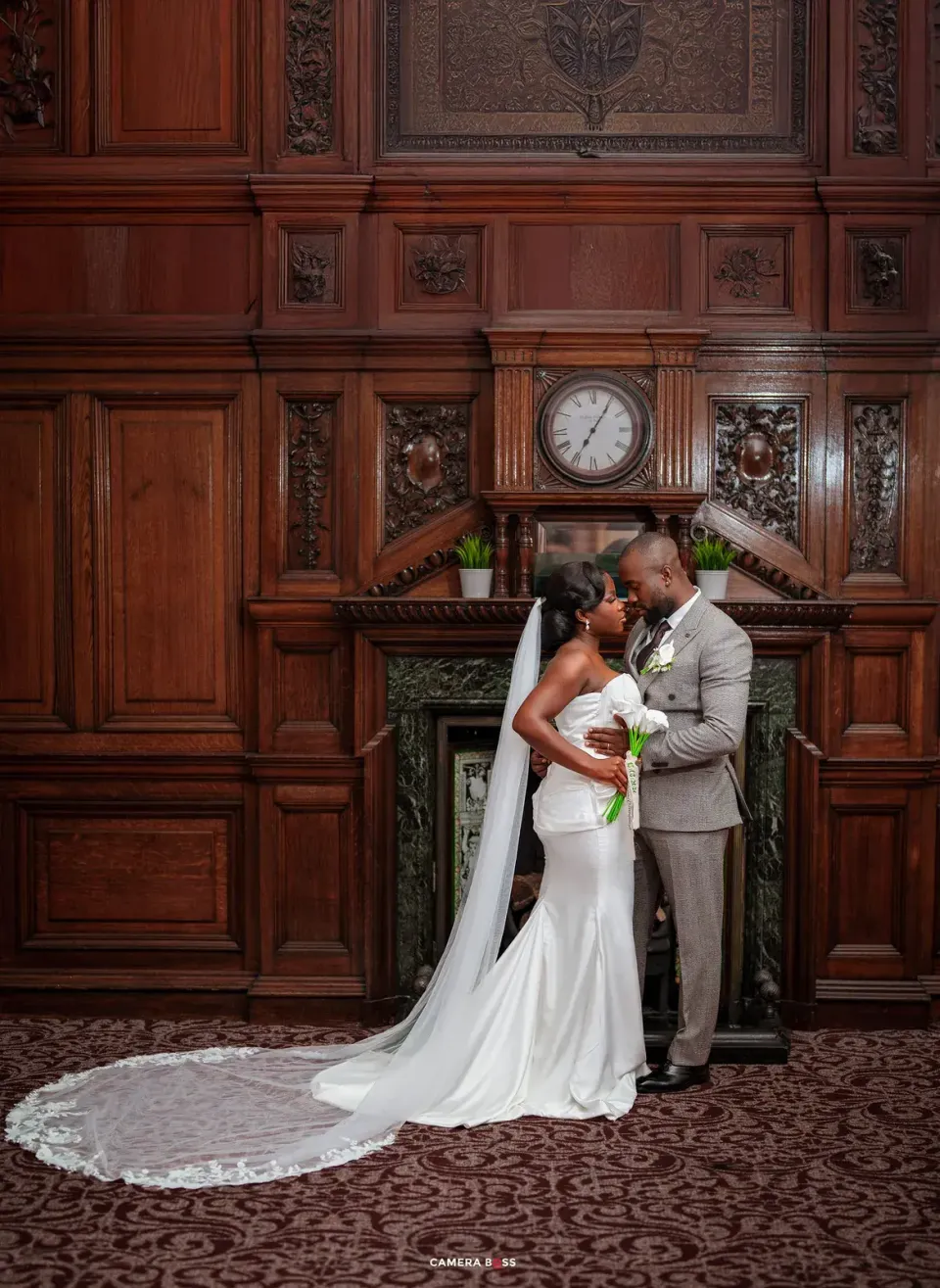 The couple embrace before their ceremony. CameraBoss portfolio: Opeyemi Wedding Portrait.