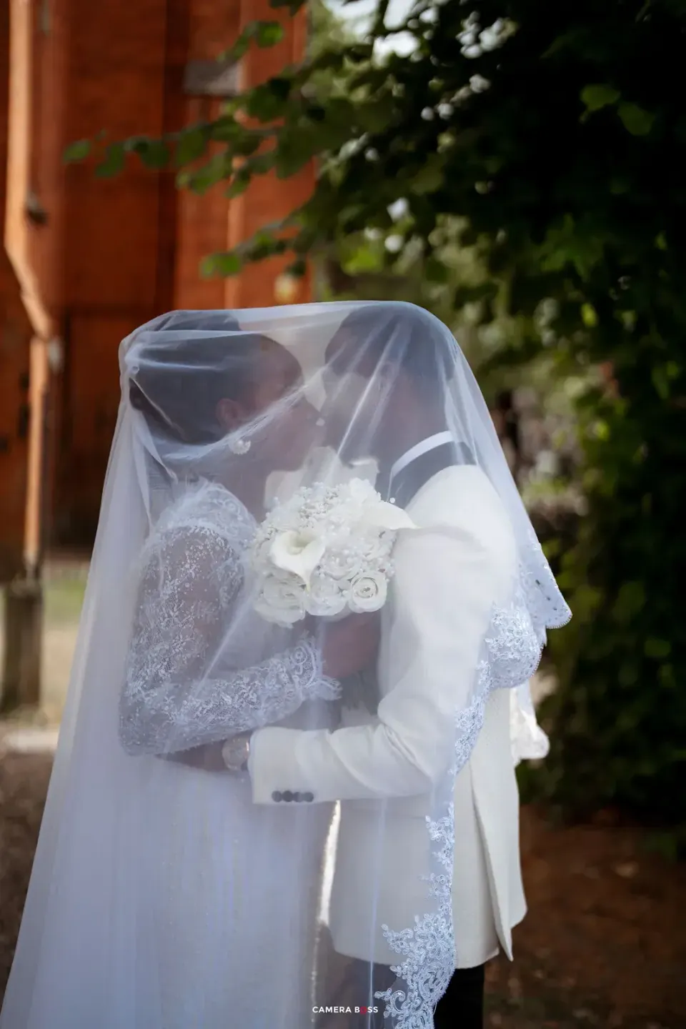 Temi behind her wedding veil. CameraBoss portfolio: Temi and Fiyin.