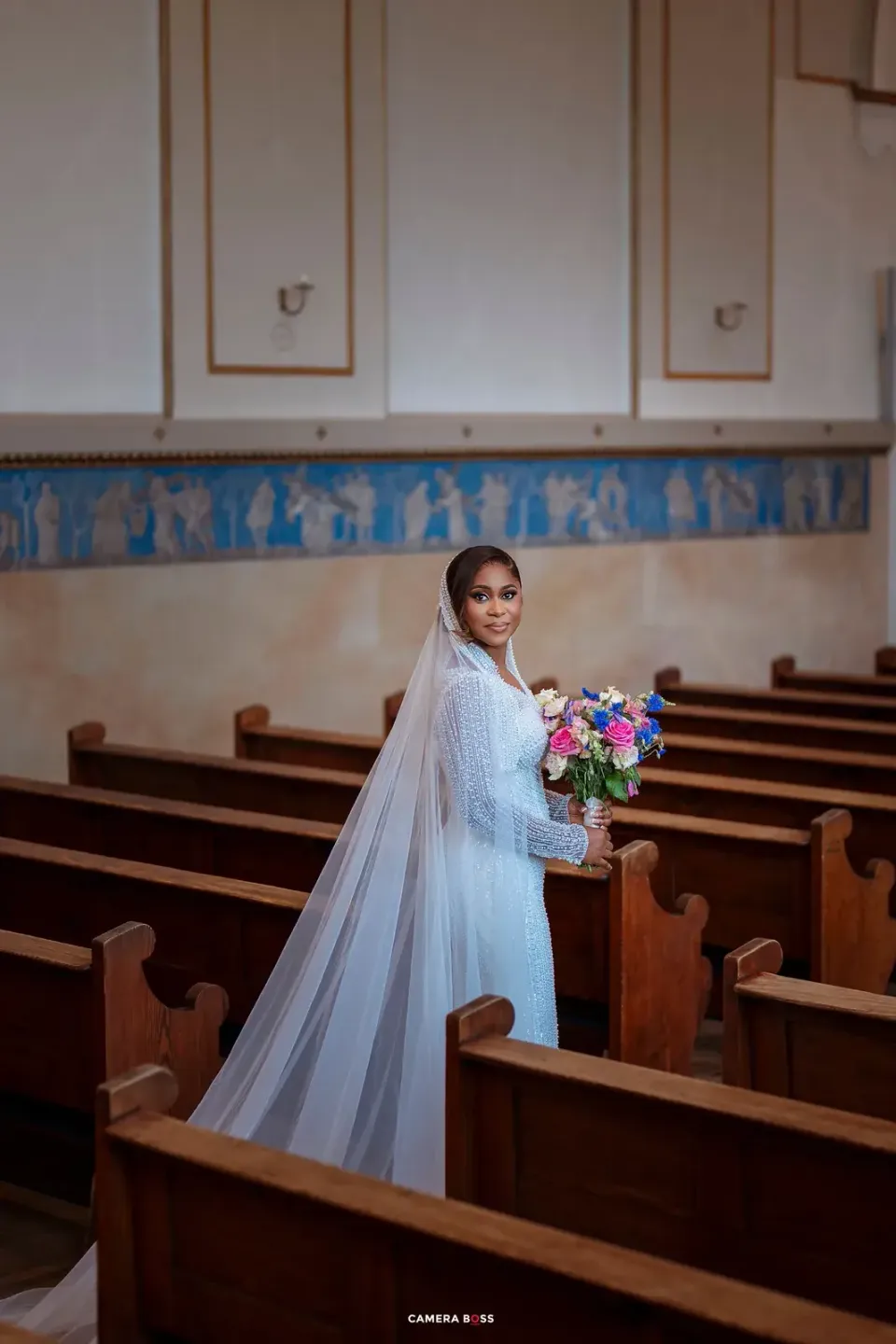Cynthia holding her wedding bouquet. CameraBoss portfolio: Cynthia and Oswaldo.