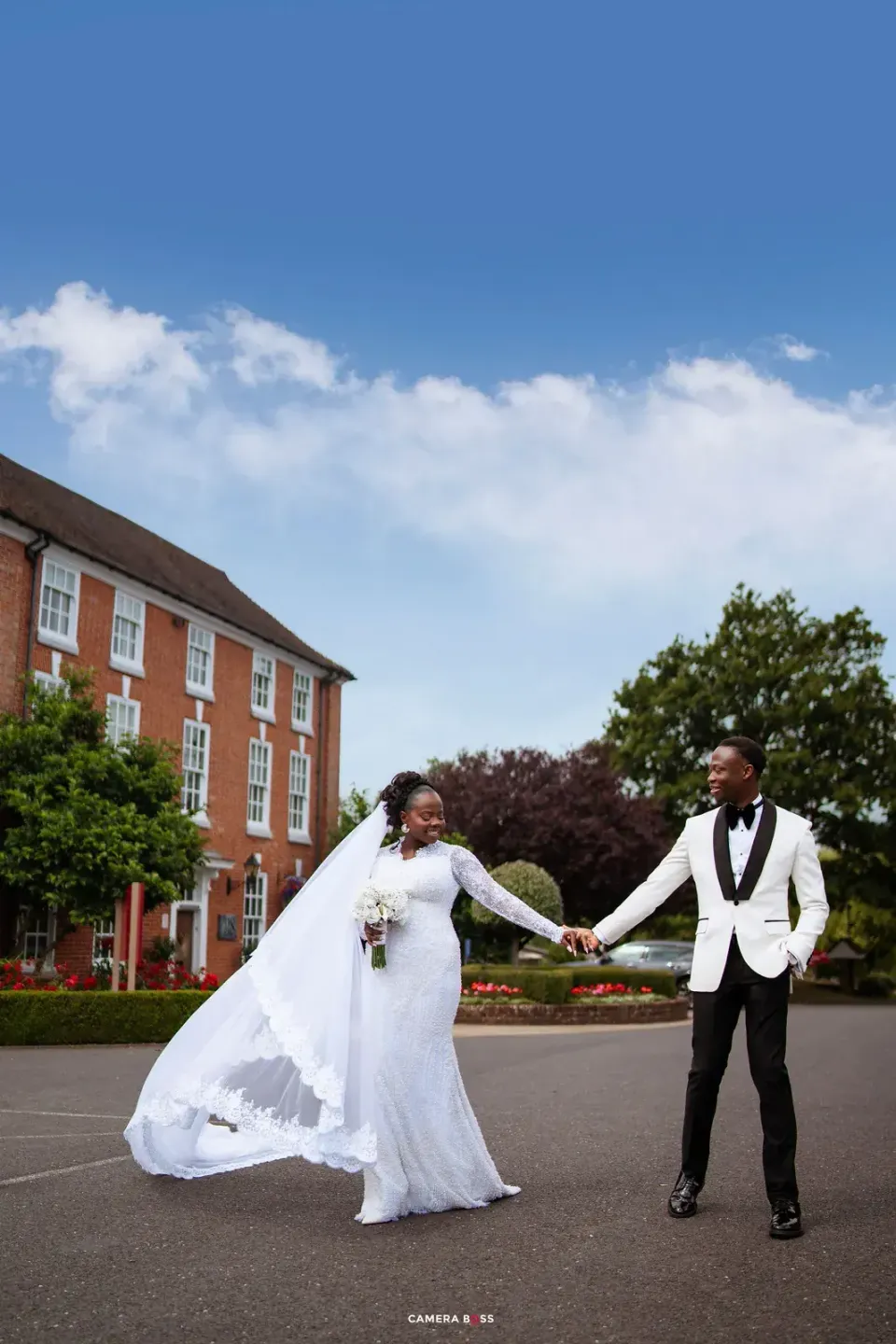 The couple walking together outdoors. CameraBoss portfolio: Temi and Fiyin.