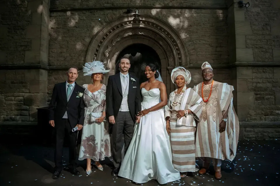 The couple with family after the ceremony