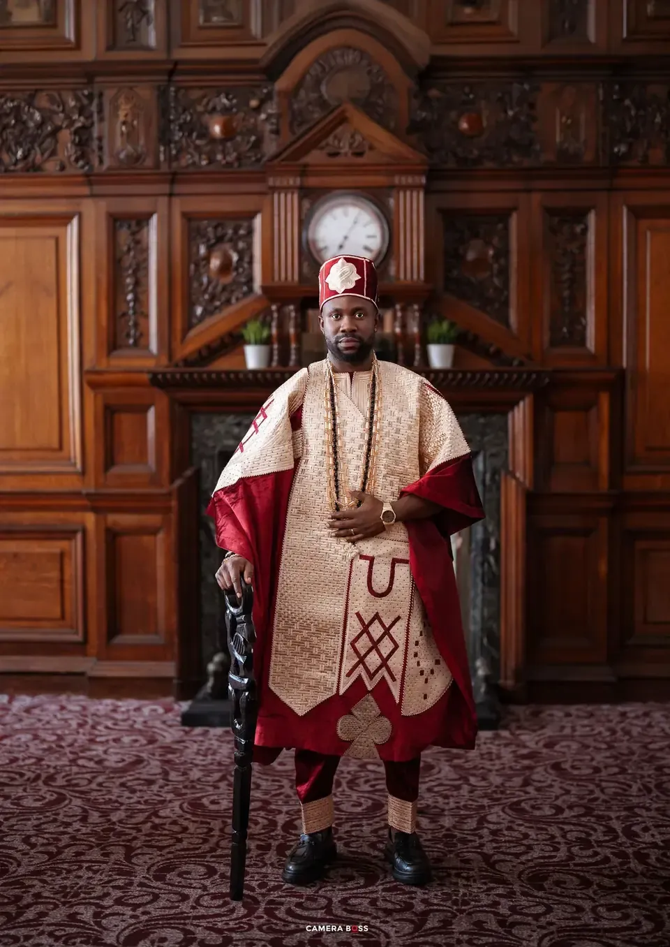 The groom in traditional red attire
