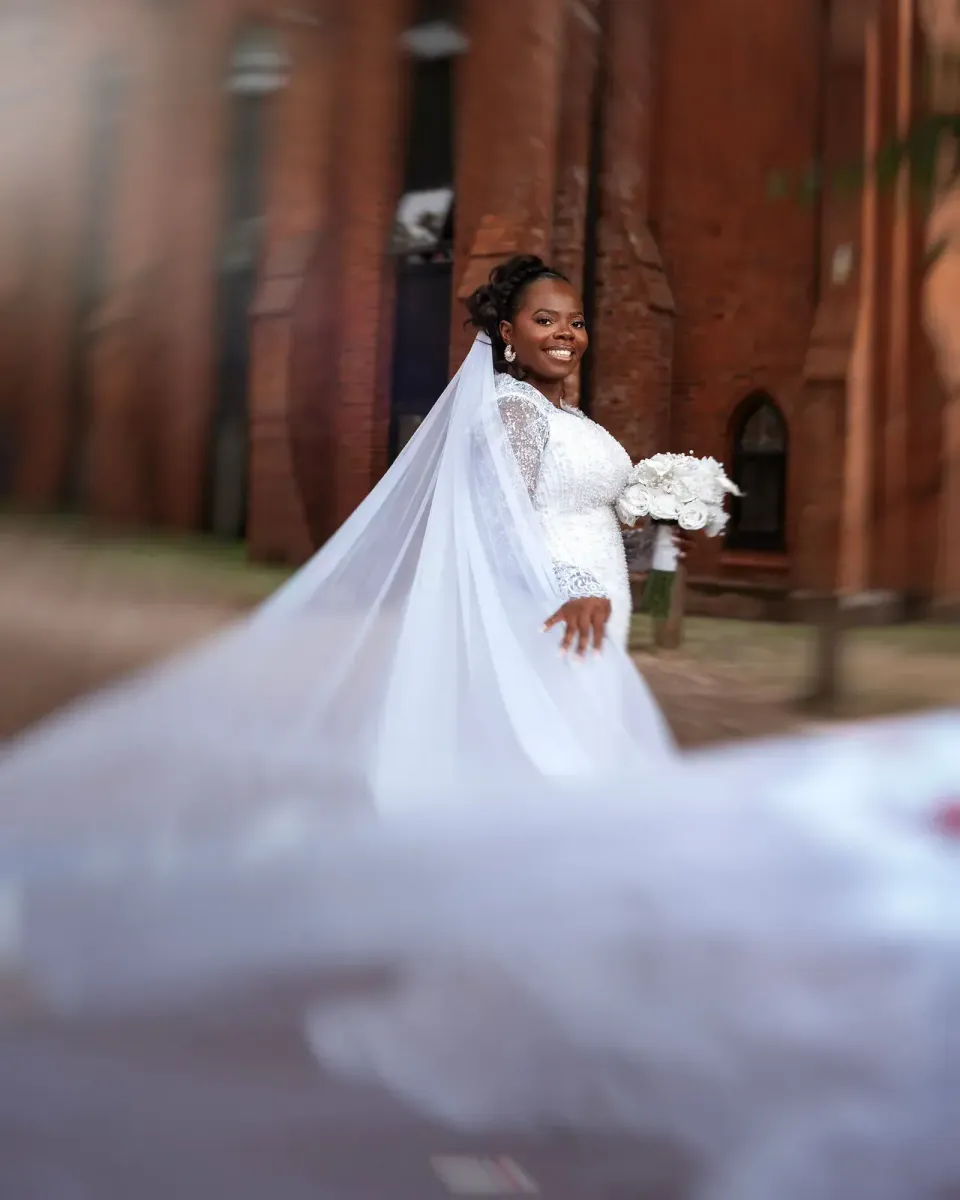 Temi in her white wedding dress. CameraBoss portfolio: Temi and Fiyin.