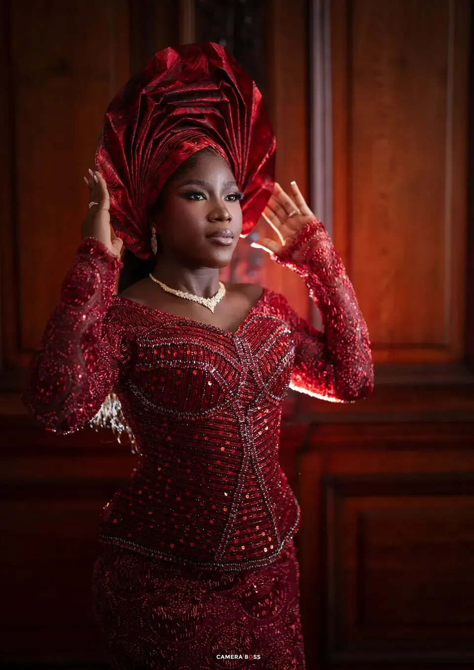 Opeyemi in red traditional wedding dress