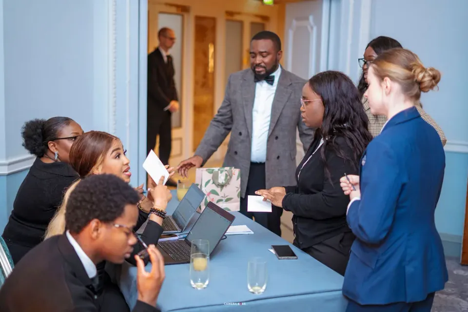Guests speaking with the welcome team at FLAIR Summit