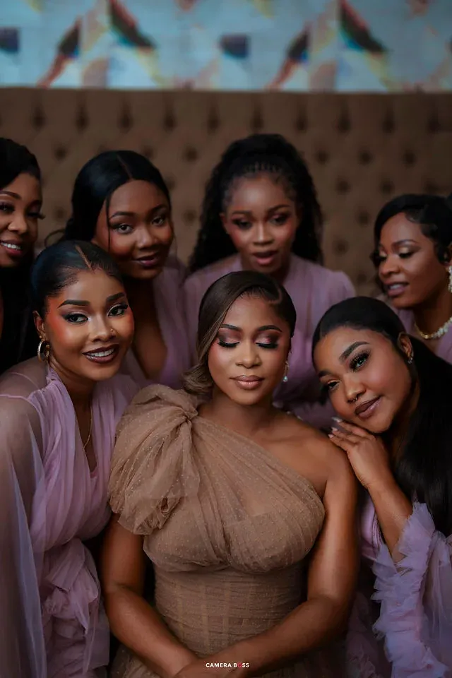 The bride and bridesmaids leaning together for a portrait. CameraBoss portfolio: Cynthia and Oswaldo.