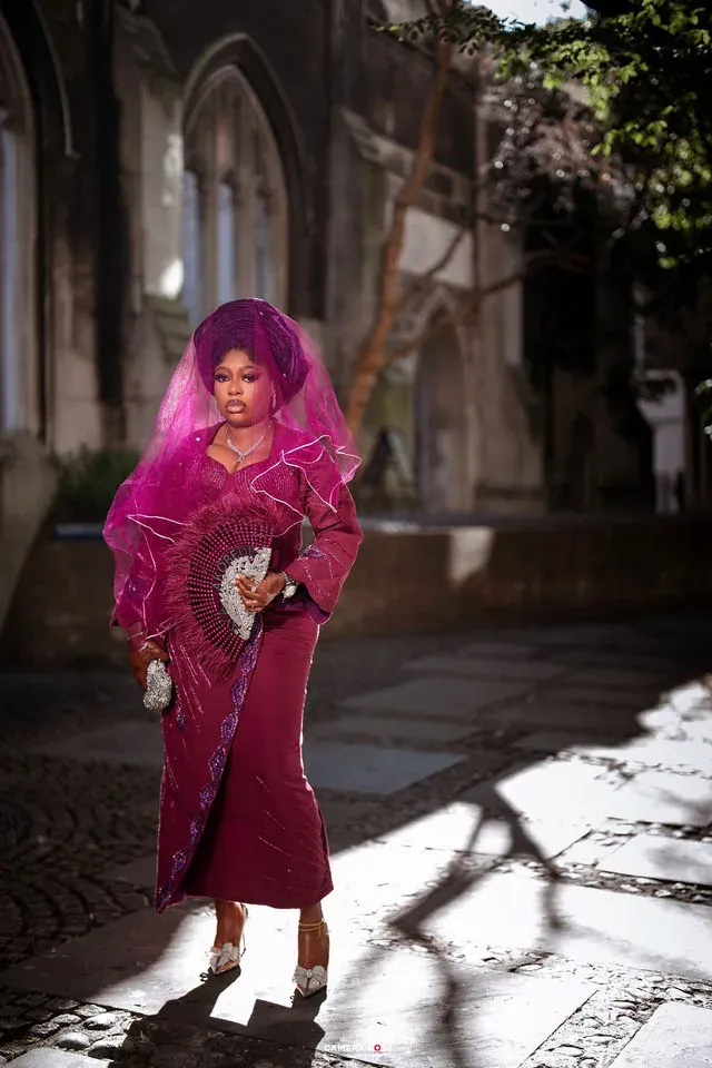 A full-length portrait in purple formal attire. CameraBoss portfolio: Korede Prewedding.