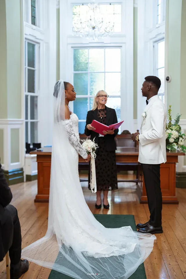 Remi and Daniel standing with the registrar. CameraBoss portfolio: Remi and Daniel’s Bournemouth civil wedding.