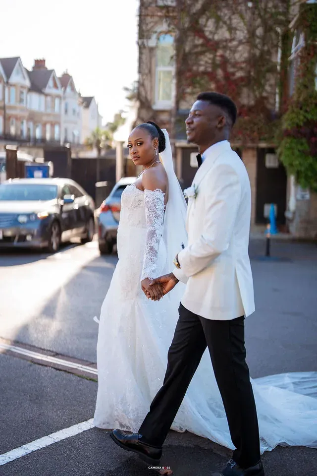 Remi and Daniel walking along the street. CameraBoss portfolio: Remi and Daniel’s Bournemouth civil wedding.