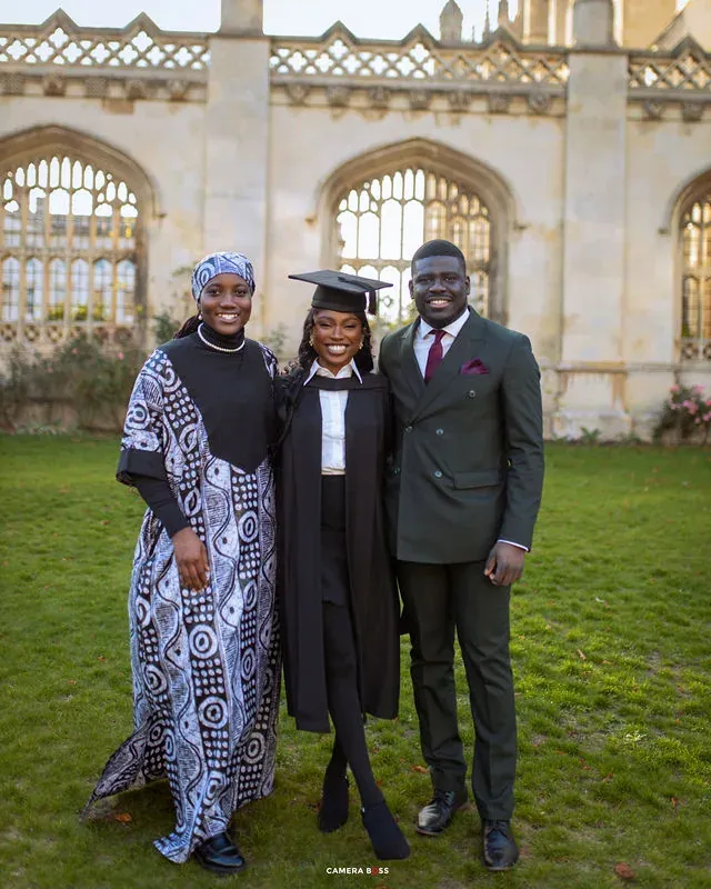 A graduation group portrait outside a stone gateway. CameraBoss portfolio: Peters Grad.