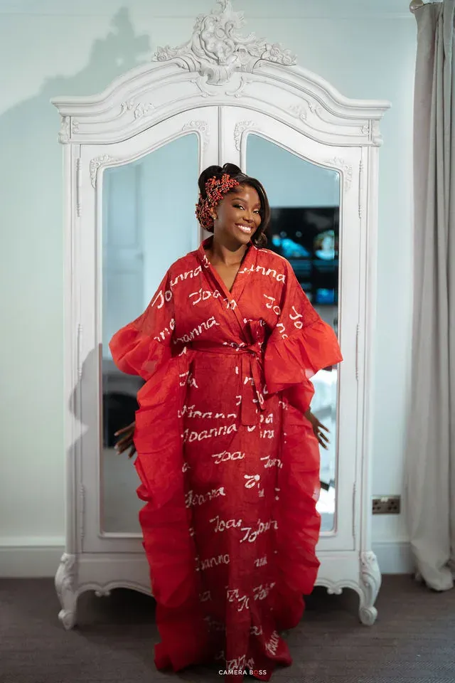Jo standing in a red dressing gown while getting ready. CameraBoss portfolio: Jo and Jonny.