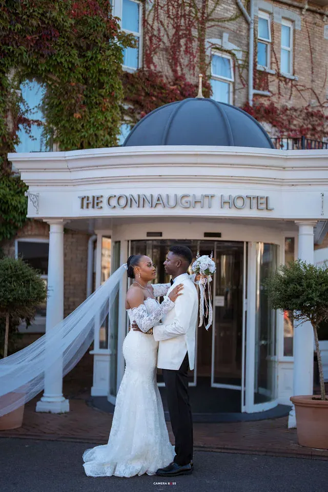 Remi and Daniel with her veil moving beside them. CameraBoss portfolio: Remi and Daniel’s Bournemouth civil wedding.