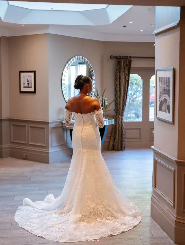 Remi’s wedding dress and train seen from behind. CameraBoss portfolio: Remi and Daniel’s Bournemouth civil wedding.