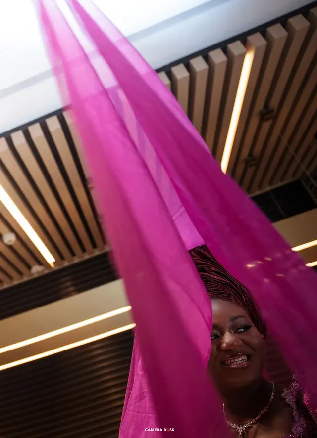 A portrait framed by a purple veil and staircase. CameraBoss portfolio: Tolu Prewedding Birmingham.