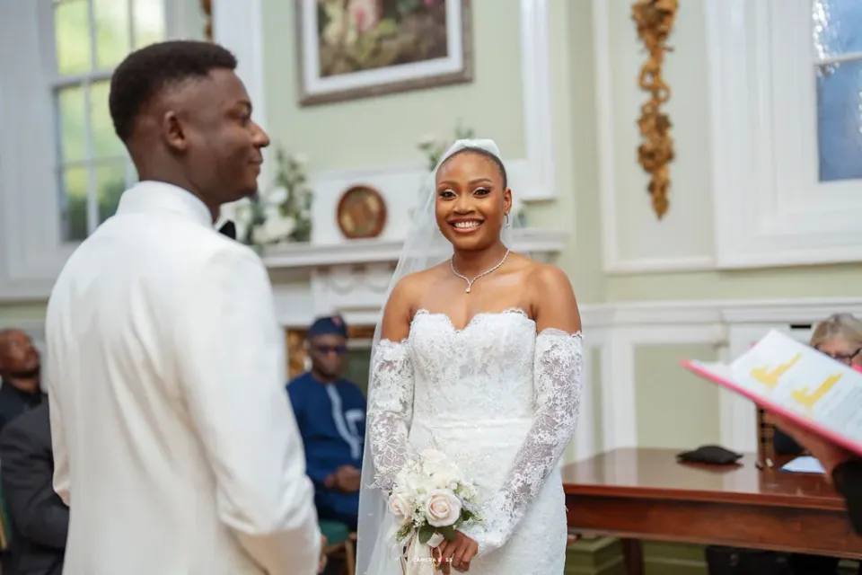 Remi and Daniel smiling together during their vows. Remi and Daniel’s Bournemouth civil wedding.