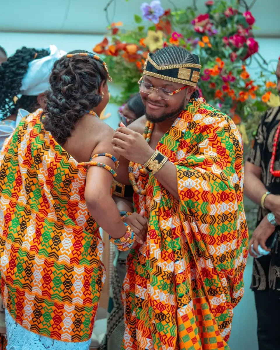 Deacon Famous and Faith dancing together at their wedding in Accra