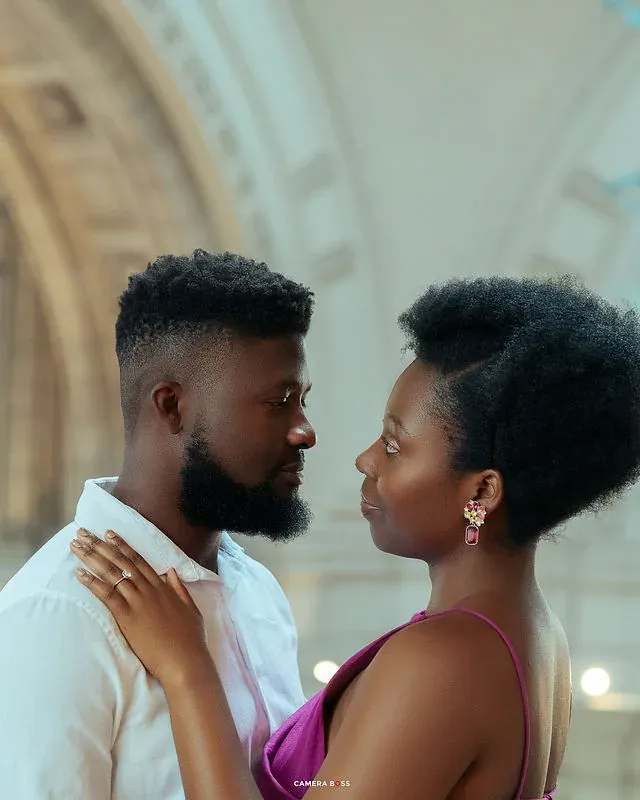 A couple embracing in a close portrait indoors. CameraBoss portfolio: Tomilayo Prewedding London.