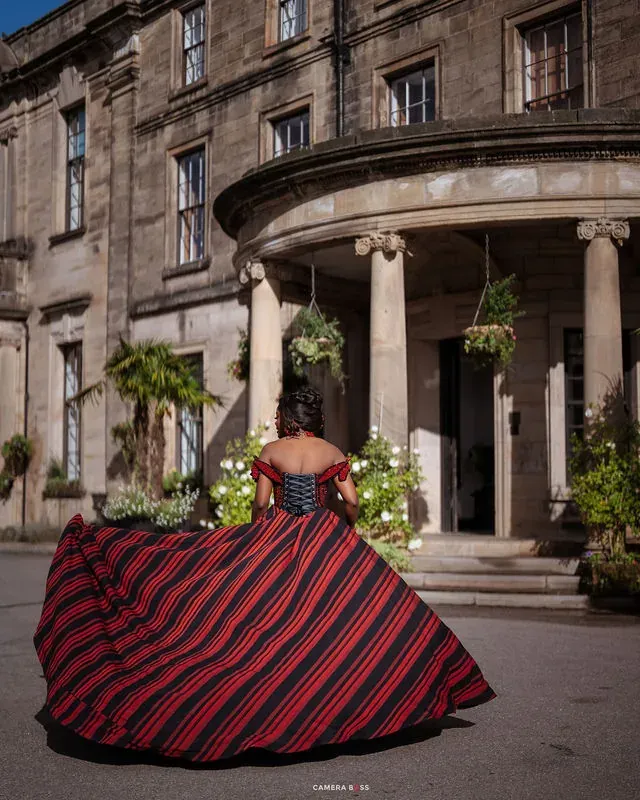 Jo turning in her dress outside the entrance. CameraBoss portfolio: Jo and Jonny.