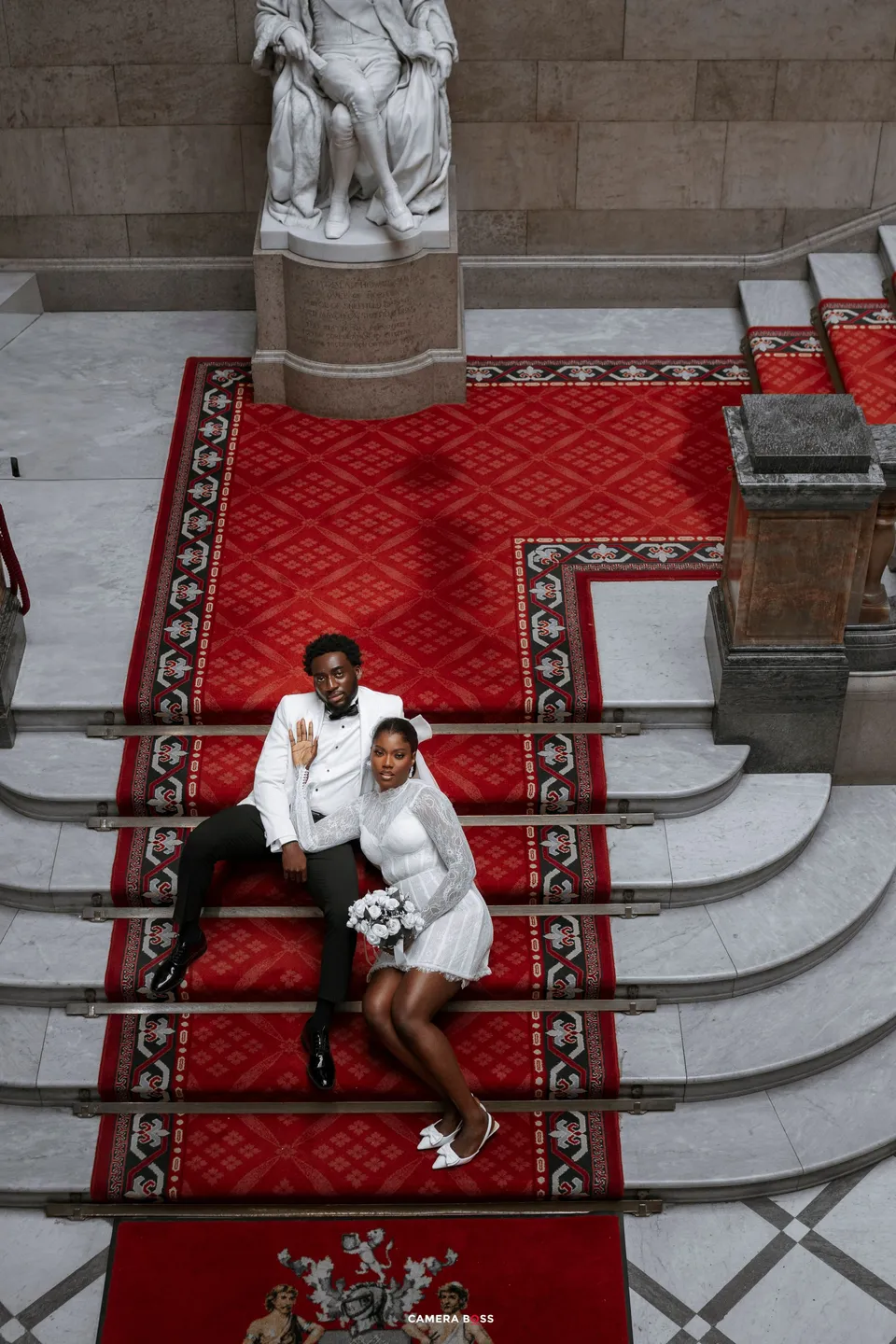 Couple together on the staircase at their civil wedding