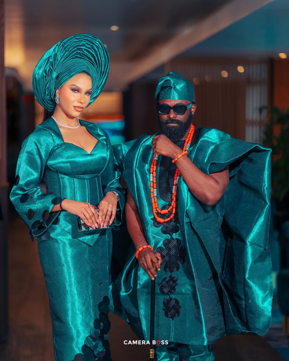 Couple in teal traditional wedding attire